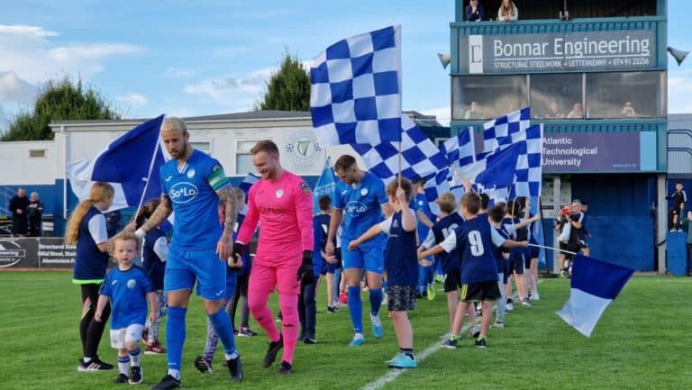 Ryan Flood of Finn Harps leads the mascots and team onto the pitch at Finn Park. July 2023