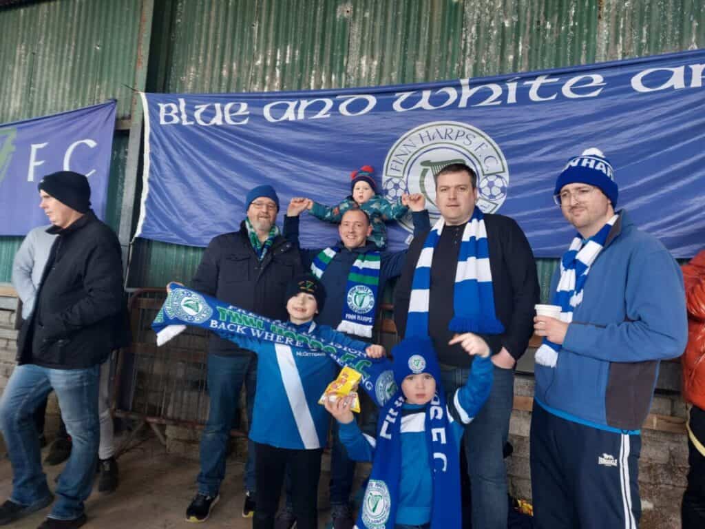 Devine Family Members at their traditional spot in the shed